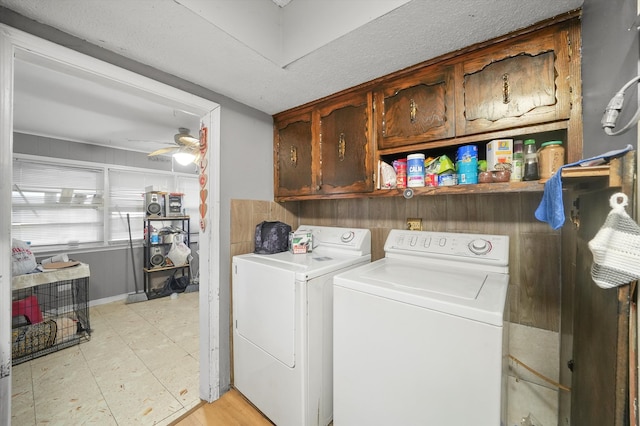 laundry room featuring separate washer and dryer, cabinets, and ceiling fan