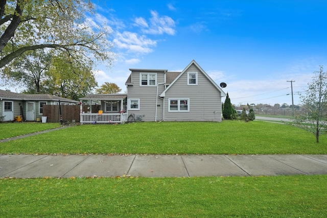 view of front of house featuring a front lawn and covered porch