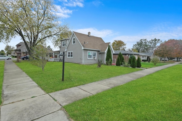 view of home's exterior with a yard