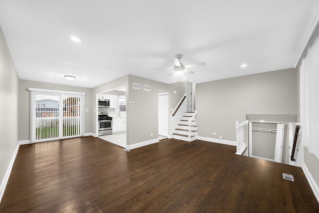 unfurnished living room with hardwood / wood-style floors and ceiling fan