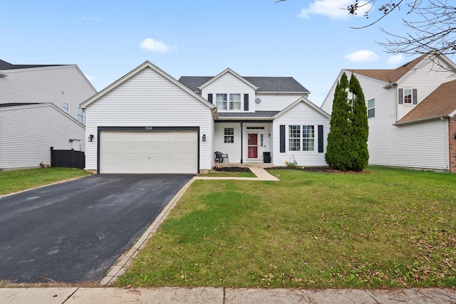 view of front of home featuring a garage and a front lawn