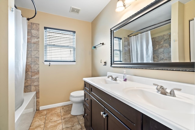 full bathroom with tile patterned flooring, vanity, shower / bath combo, and toilet