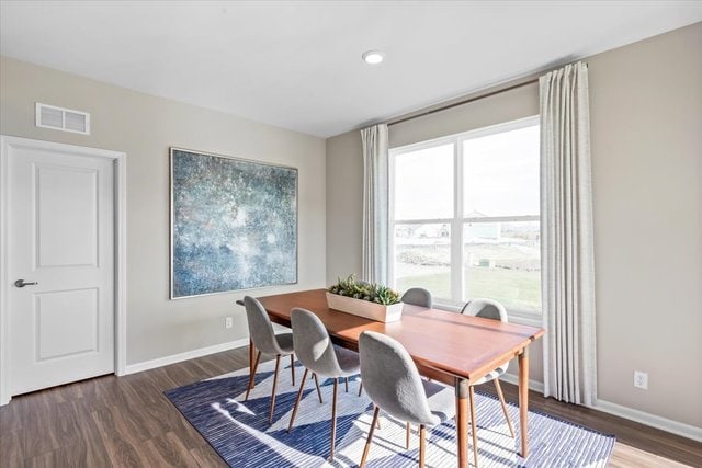 home office featuring plenty of natural light and dark hardwood / wood-style floors