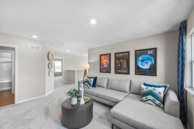 384 W Point Cir, Algonquin, IL 60102 - carpeted living area with baseboards and recessed lighting