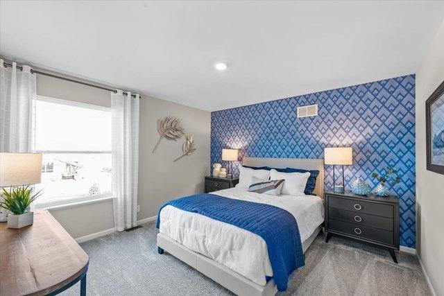 384 W Point Cir, Algonquin, IL 60102 - bedroom featuring an accent wall, wallpapered walls, baseboards, and carpet