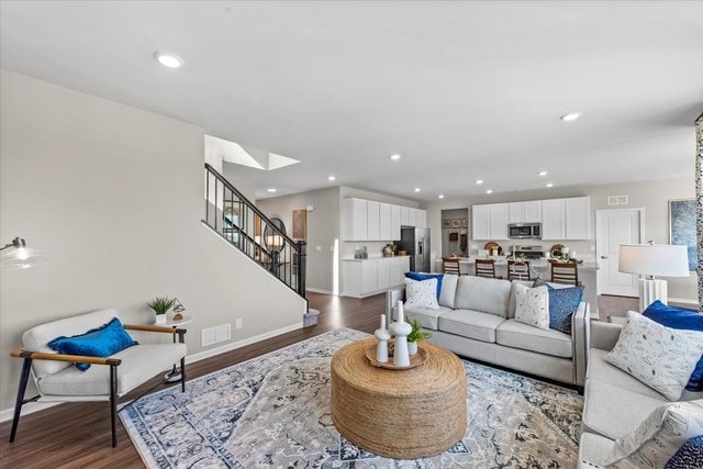 living room featuring dark hardwood / wood-style floors