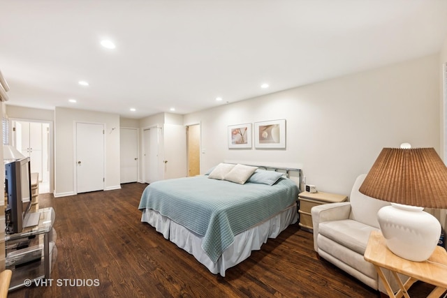 bedroom with dark hardwood / wood-style floors