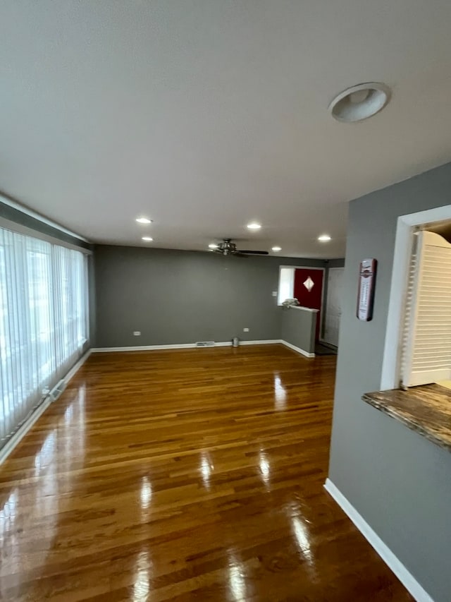 unfurnished living room featuring dark hardwood / wood-style flooring