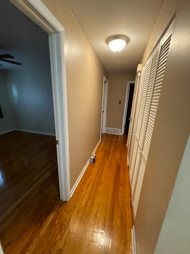 hallway featuring wood-type flooring