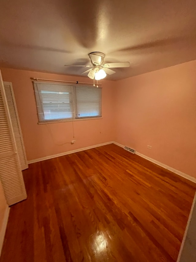 unfurnished bedroom featuring ceiling fan and wood-type flooring