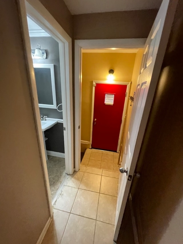 corridor featuring light tile patterned floors