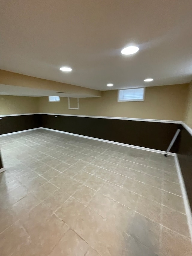 basement featuring light tile patterned floors