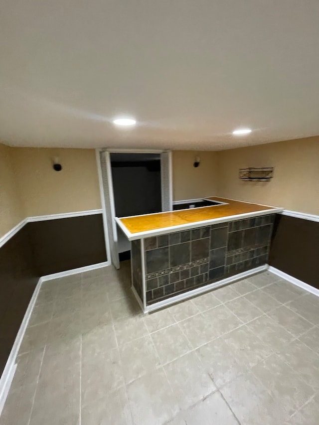 bar with light tile patterned floors