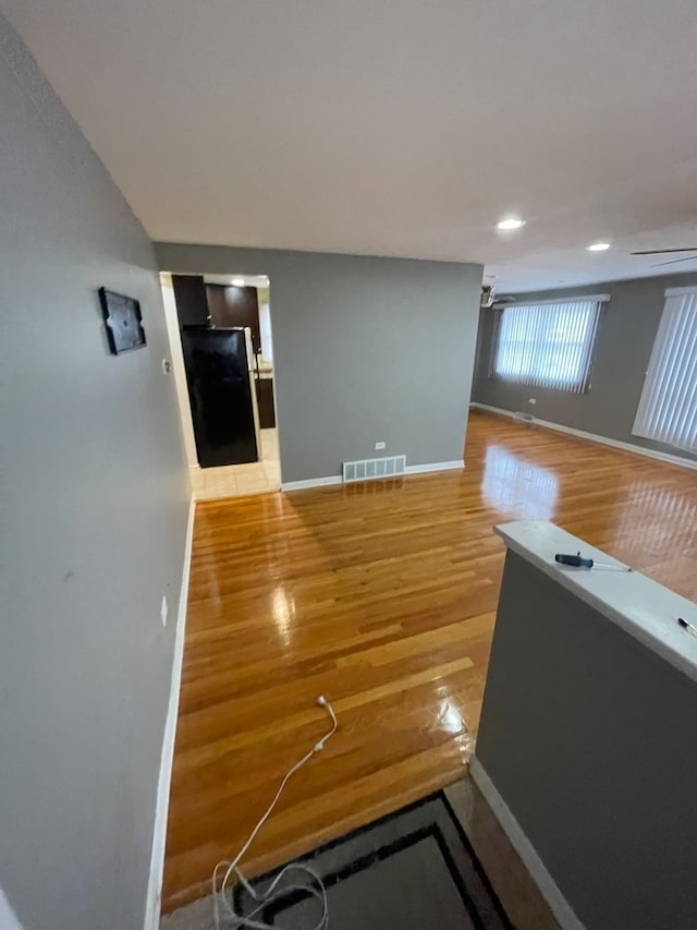 unfurnished living room with light hardwood / wood-style floors