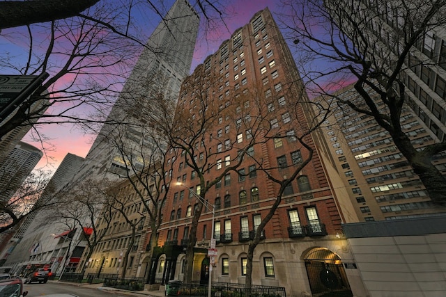 view of outdoor building at dusk