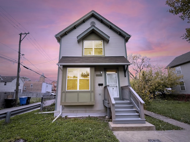 view of front of house with a yard