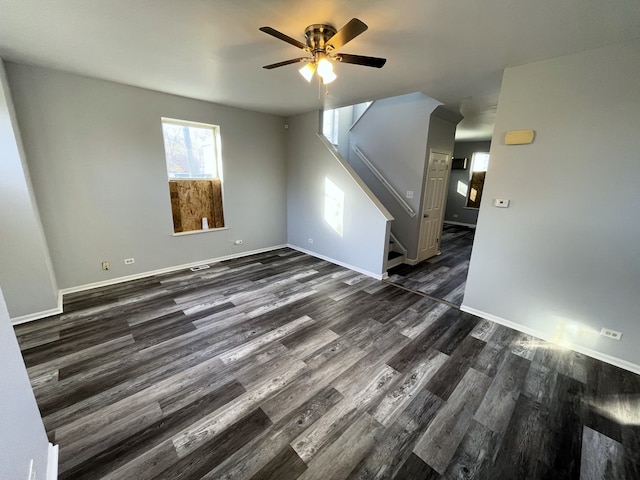 empty room featuring dark hardwood / wood-style flooring and ceiling fan