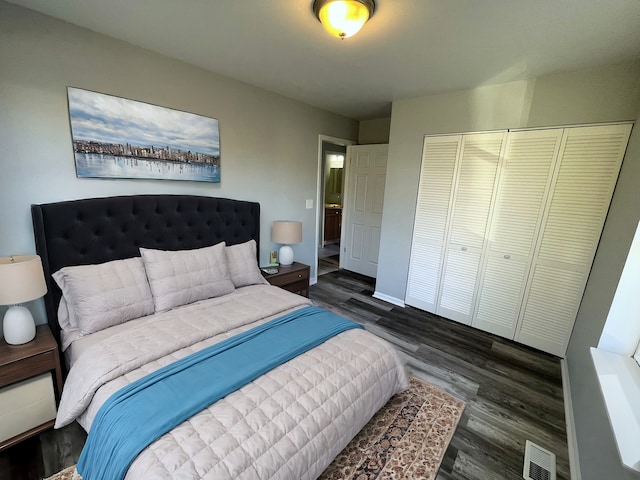 bedroom featuring a closet and dark hardwood / wood-style floors