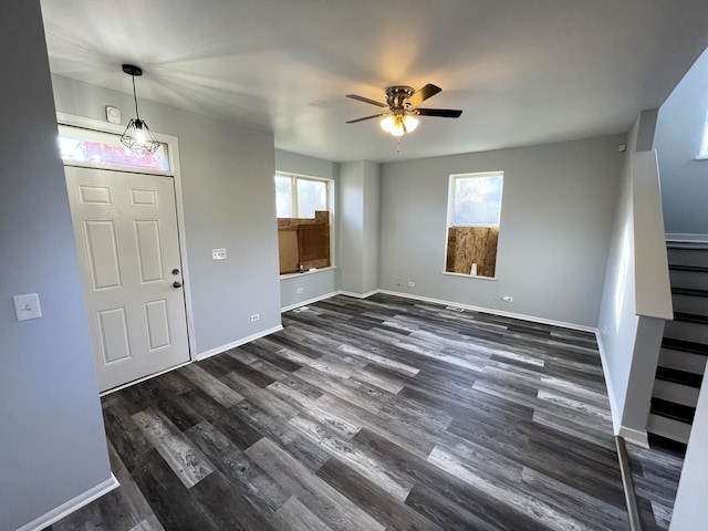 entryway with dark wood-type flooring and ceiling fan