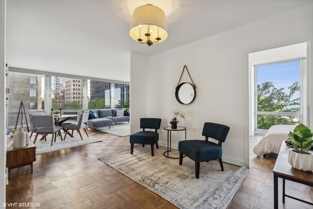 living area featuring dark parquet floors