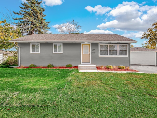 single story home featuring a front lawn