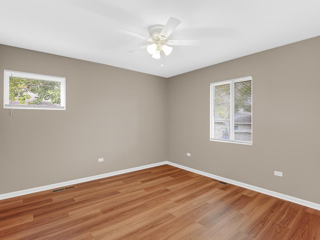 unfurnished room featuring ceiling fan and light hardwood / wood-style flooring