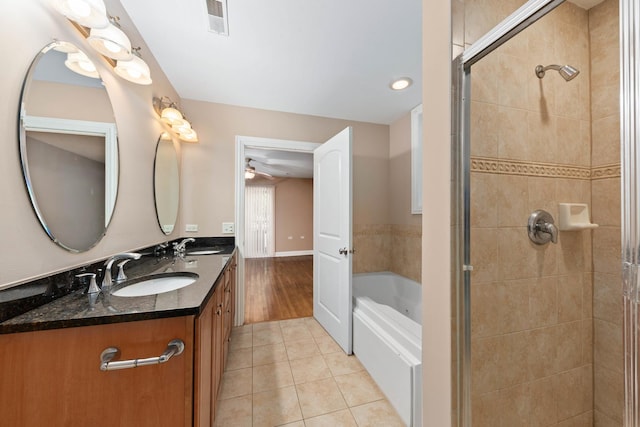 bathroom with tile patterned flooring, vanity, ceiling fan, and independent shower and bath