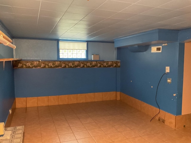 basement featuring tile patterned flooring
