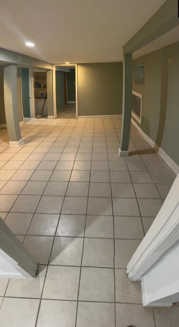 basement featuring tile patterned flooring