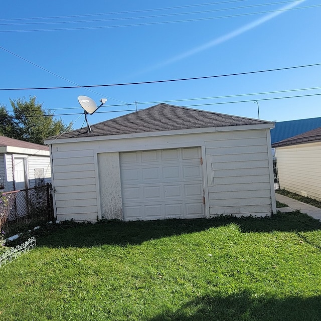 garage with a yard