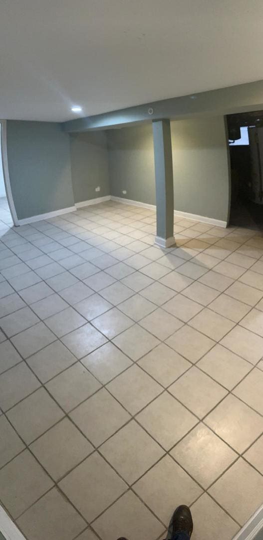 basement with light tile patterned floors