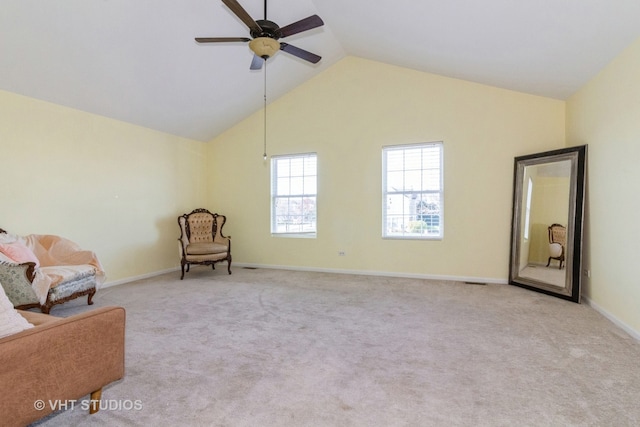 living area with high vaulted ceiling, light carpet, and ceiling fan