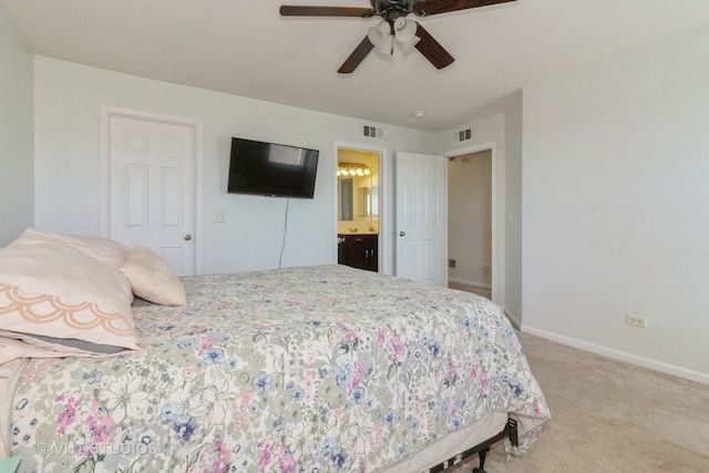 carpeted bedroom with connected bathroom and ceiling fan