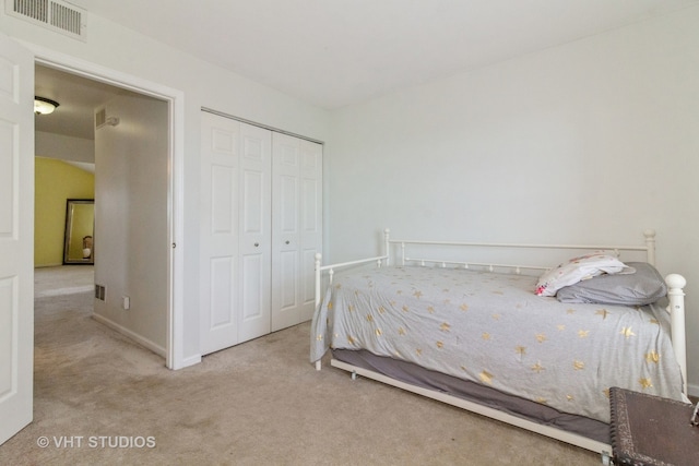 carpeted bedroom featuring a closet