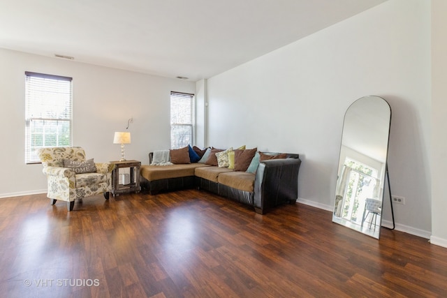 living room with dark hardwood / wood-style flooring