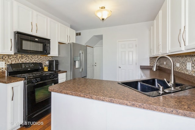 kitchen with black appliances, tasteful backsplash, white cabinetry, and sink