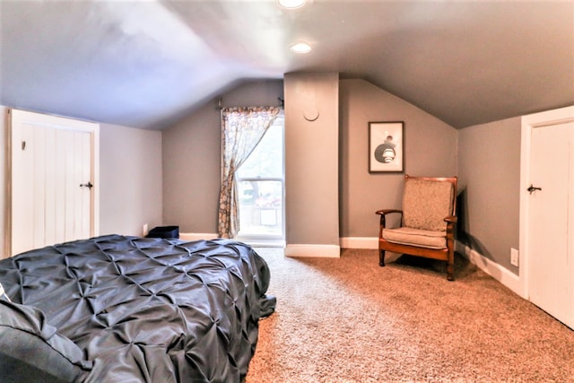 carpeted bedroom with vaulted ceiling