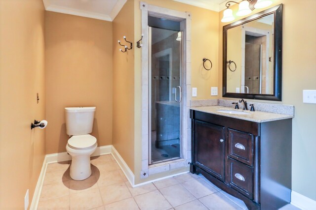 bathroom featuring walk in shower, ornamental molding, vanity, tile patterned flooring, and toilet