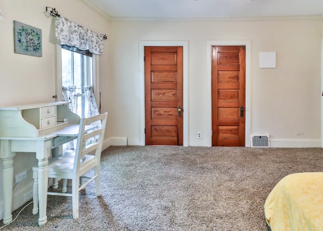 carpeted bedroom featuring crown molding