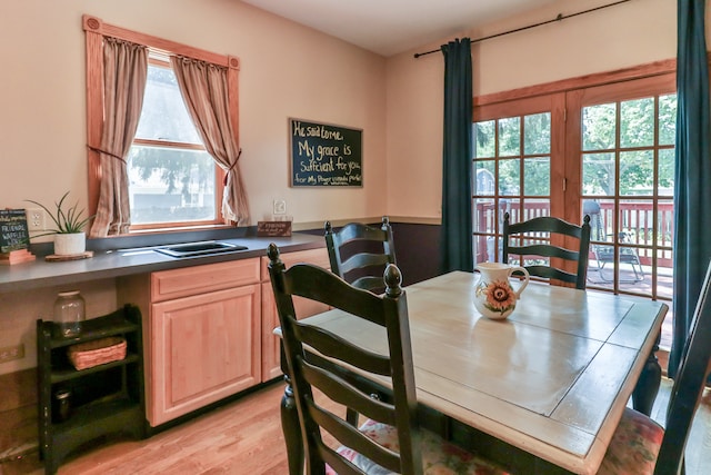 dining space with light hardwood / wood-style floors