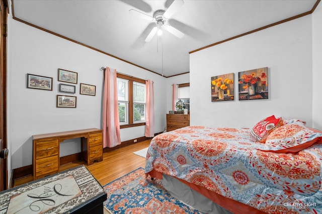 bedroom featuring light wood-type flooring, ceiling fan, and crown molding