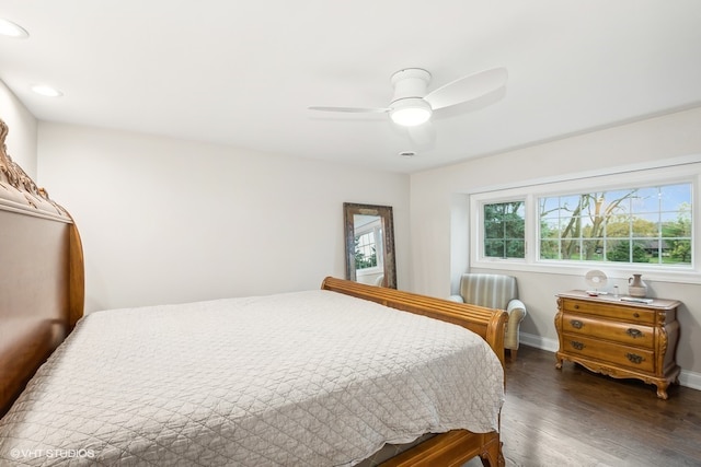 bedroom featuring ceiling fan and dark hardwood / wood-style flooring