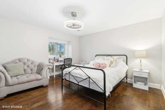 bedroom featuring dark hardwood / wood-style flooring