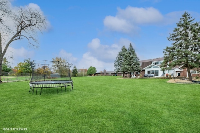 view of yard with a trampoline