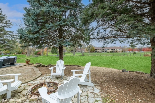 view of patio / terrace with a fire pit