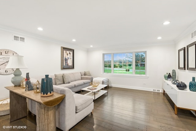 living room with ornamental molding and dark wood-type flooring