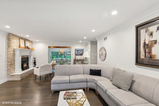 living room featuring dark hardwood / wood-style flooring and ornamental molding