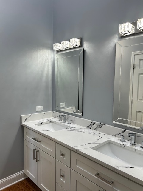 bathroom featuring hardwood / wood-style floors and vanity