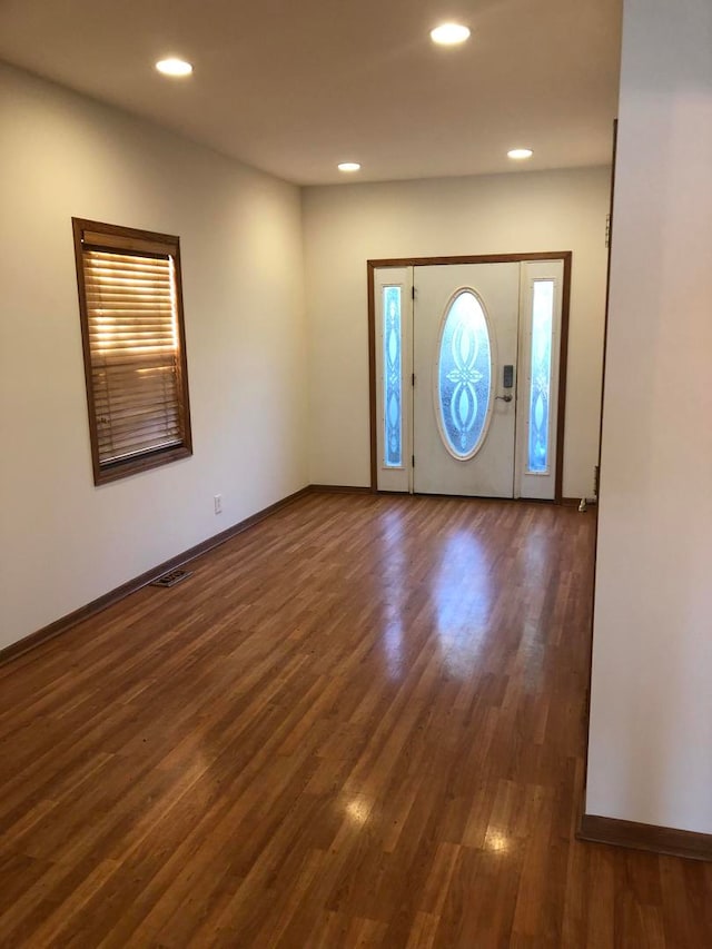 foyer with dark hardwood / wood-style floors