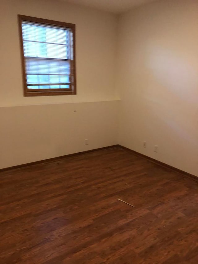 empty room featuring dark hardwood / wood-style floors